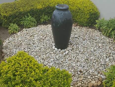 water feature surrounded by rocks